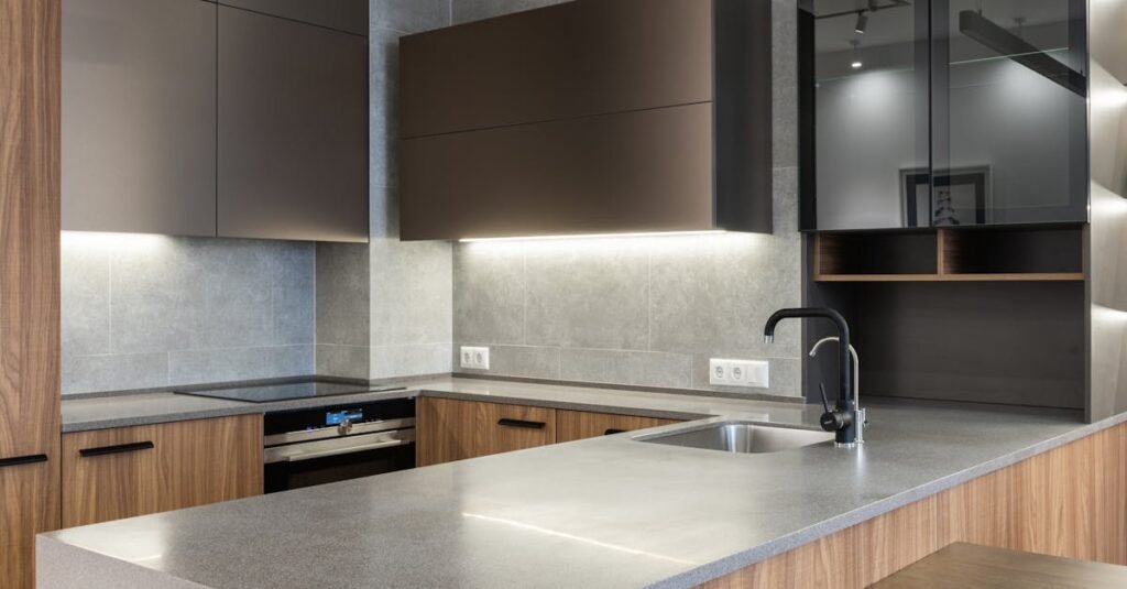 pexels-photo-6489127-6489127 Sleek and modern kitchen with contemporary appliances and wooden cabinetry.